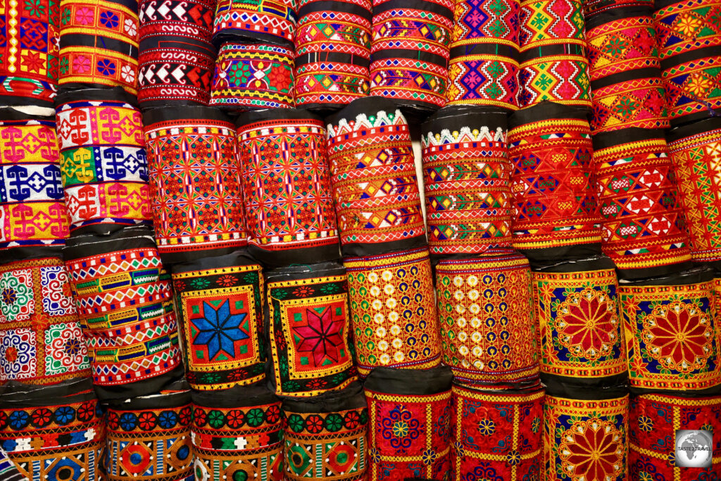 Colourful rolls of hand-woven cloth for sale at Herat bazaar.