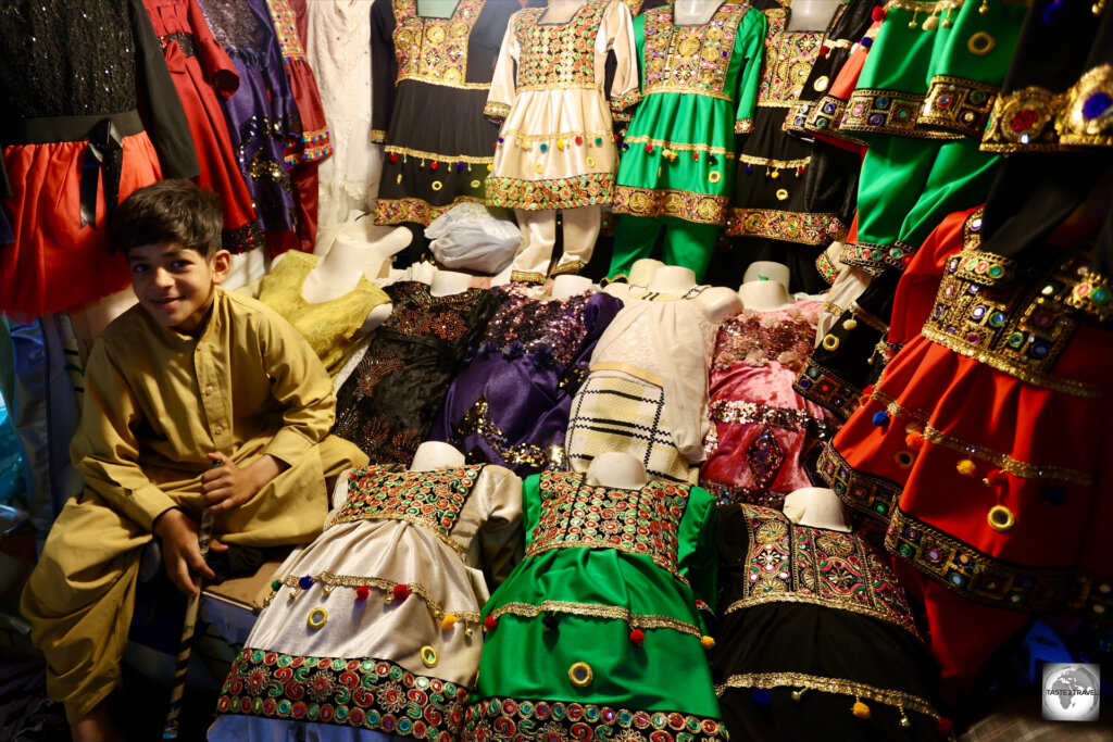 Traditional children's clothing for sale at Herat bazaar.