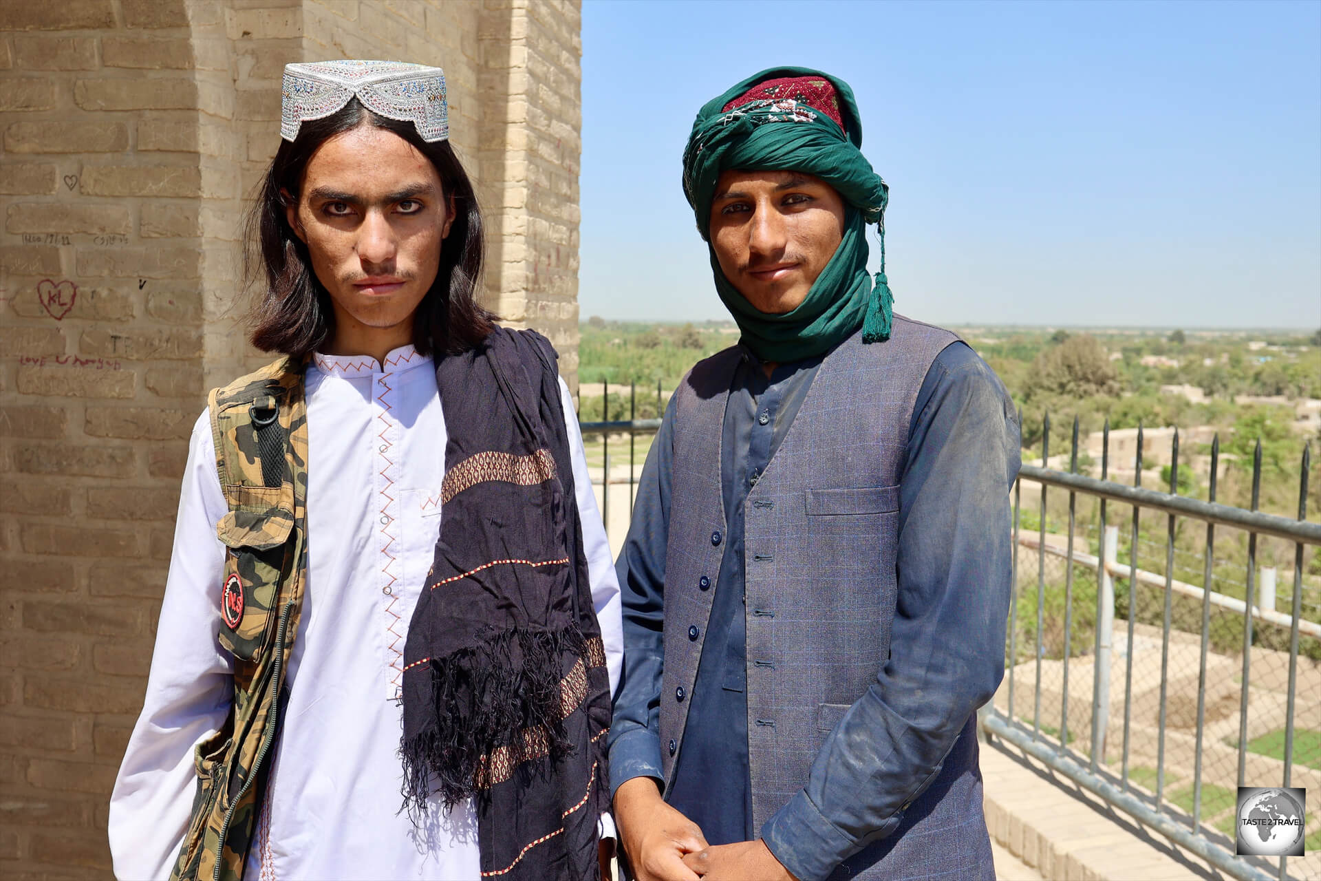 Two Pashtun men, exploring the ancient city walls in the town of Balkh,